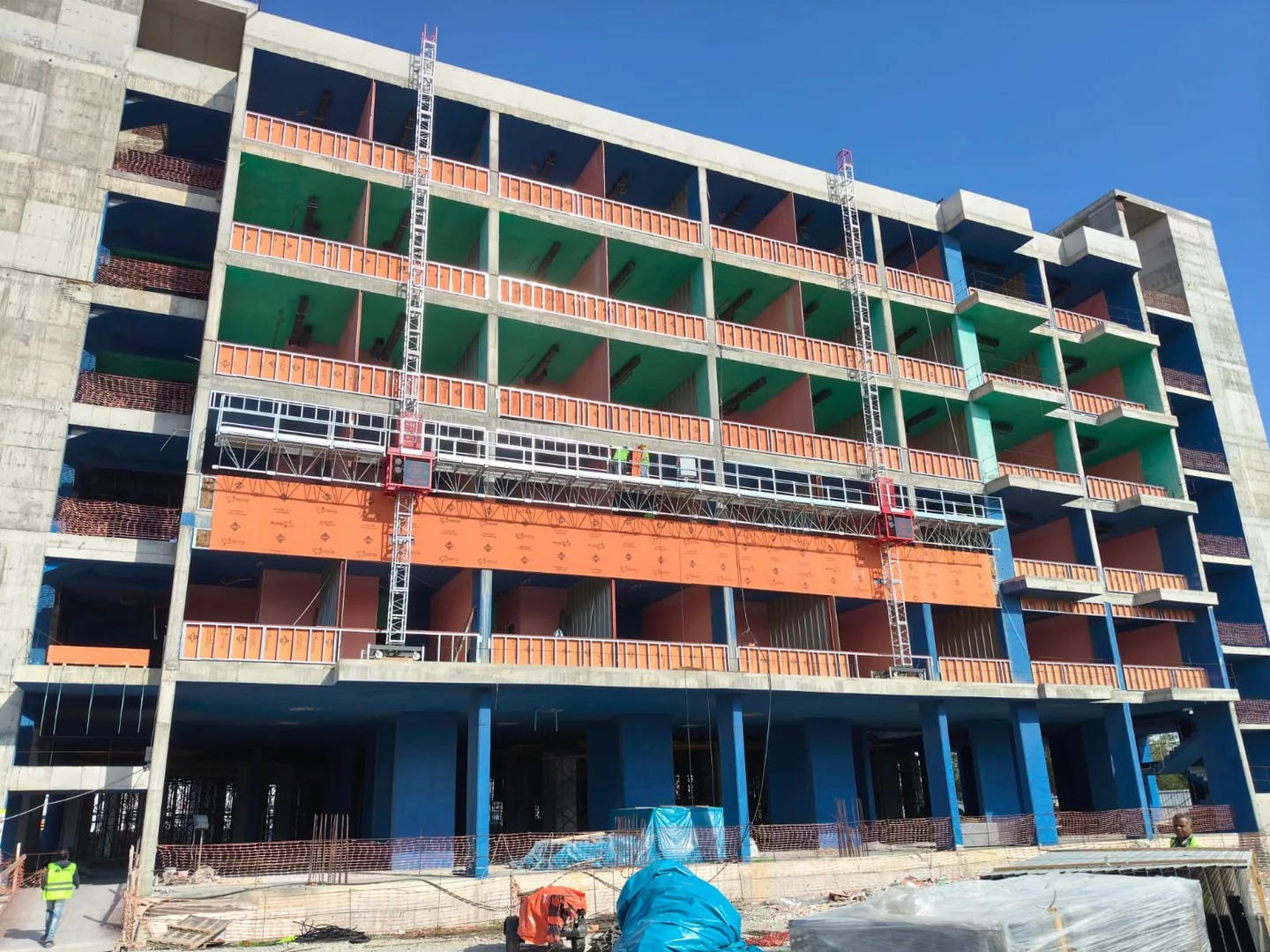 Mast climbing work platforms installed across a building facade